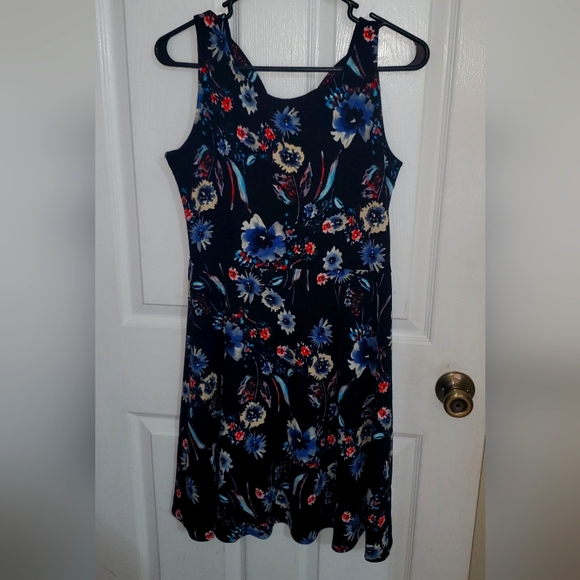 Floral Sleeveless crisscross back mini sundress. Black and Floral - Picture 1 of 4